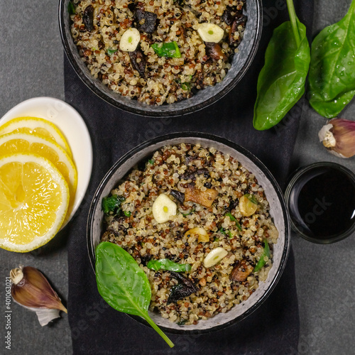 Two bowl of quinoa, mushroom and garlic salad