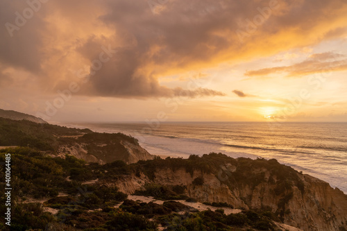 beautiful sunset with beach and sand dunes on the Alentejo coast of Portugal