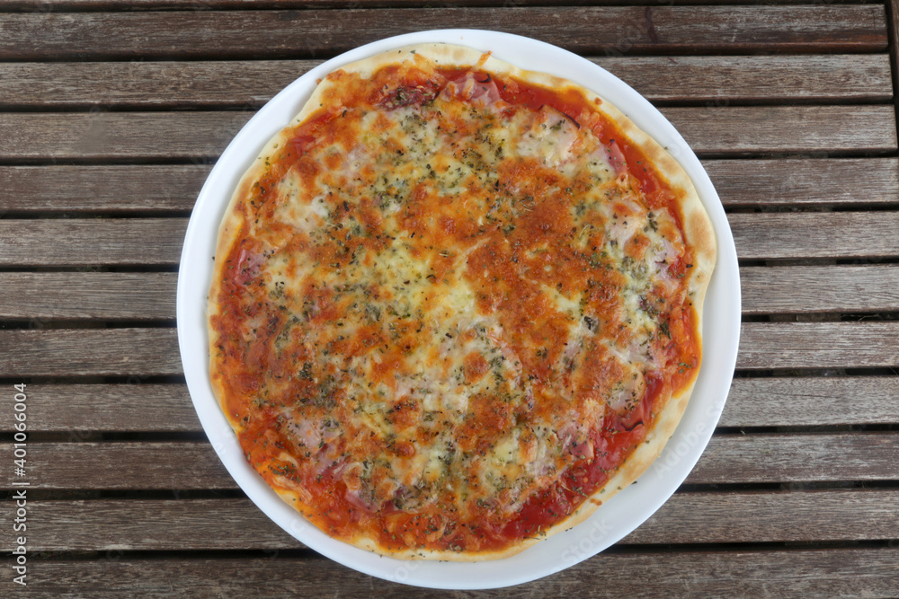 italian pizza with ham tomato and mozarella
