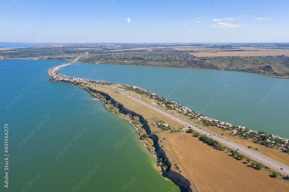 aerial view to long embankment with highway from Kyiv to Odessa city in Ukraine