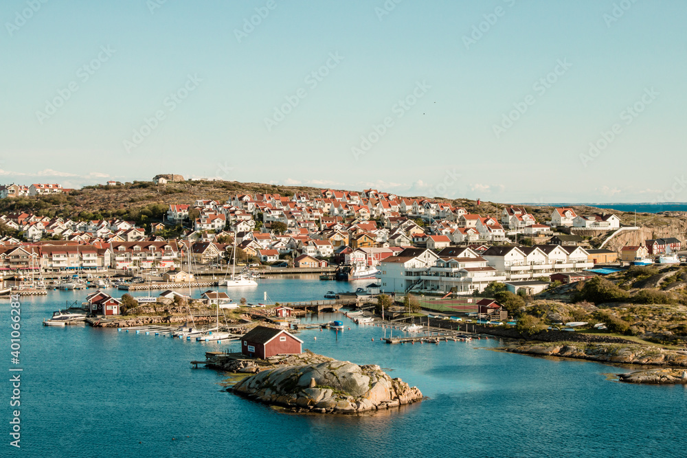 Swedish small harbour town with red houses in sea bay