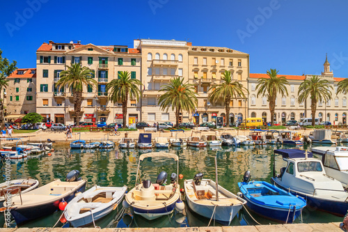 Coastal summer cityscape - view of the boat dock and the Split promenade, the Adriatic coast of Croatia, 29 June, 2019
