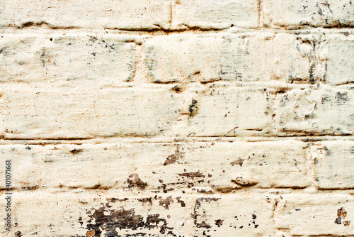 Texture of a brick wall with cracks and scratches which can be used as a background