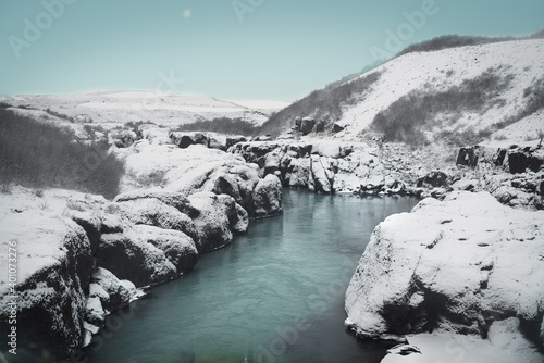 Blue river in a snowy landscape in Iceland