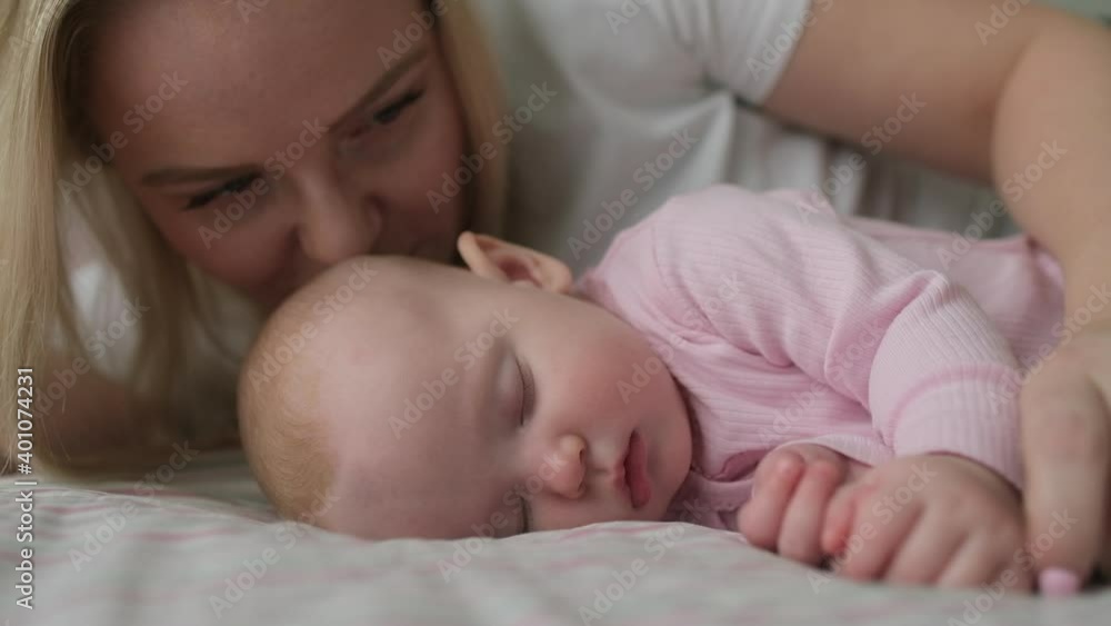 close up of portrait of young mother caring her little newborn baby in nursery room in morning, Concept of happy family and child children baby, parenthood, childhood life, maternity, motherhood close up of portrait of young mother caring her little newborn baby in nursery room in morning, Concept of happy family and child children baby, parenthood, childhood life, maternity, motherhood