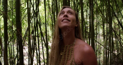 Caucasian woman smiling in bamboo forest photo