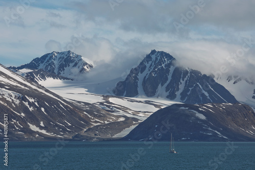 The coastline and mountains of Liefdefjord in the Svalbard Islands (Spitzbergen) in the high Arctic photo