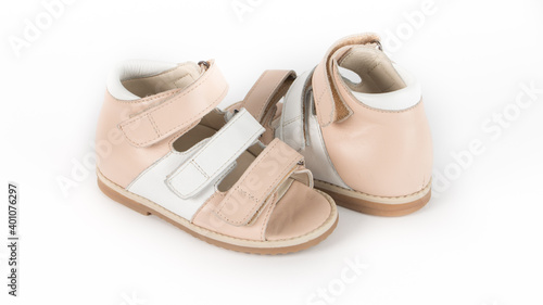 children's beige orthopedic sandals on a white background