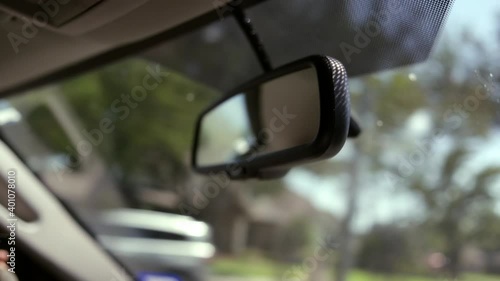 Rear-view mirror inside driving car photo