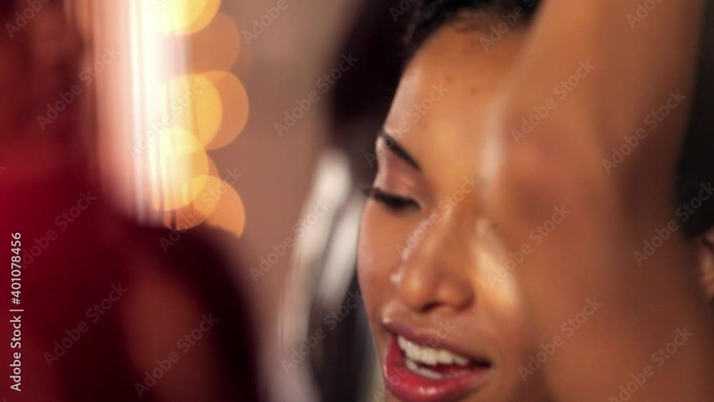 Group of friends at house party, close up on woman dancing Group of friends at house party, close up on woman dancing