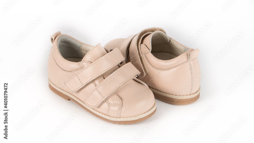 children's beige orthopedic shoes on a white background children's beige orthopedic shoes on a white background
