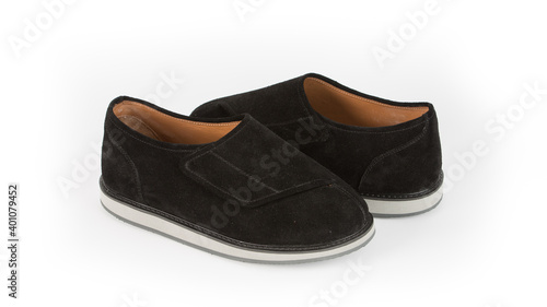 children's black orthopedic shoes on a white background