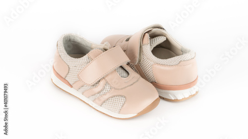 children's beige orthopedic shoes on a white background