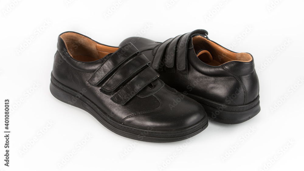 children's black orthopedic shoes on a white background children's black orthopedic shoes on a white background