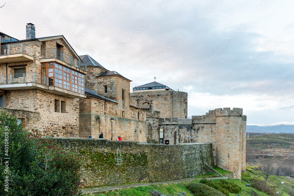 Horizontal view of the wall, house and stone castle of Puebla de Sanabria decorated with Christmas lights 2020