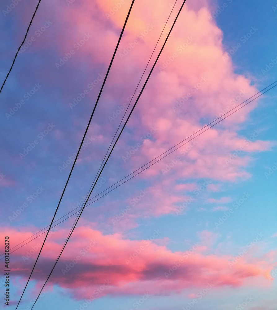 beautiful blue sky with pink clouds aesthetic style with some wires