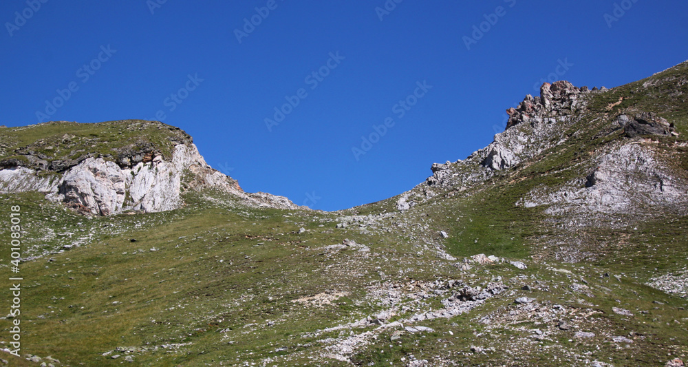 Göflaner Schartl mountain pass and rock formations at a hiking trail in the Alps seen from the Martell valley 