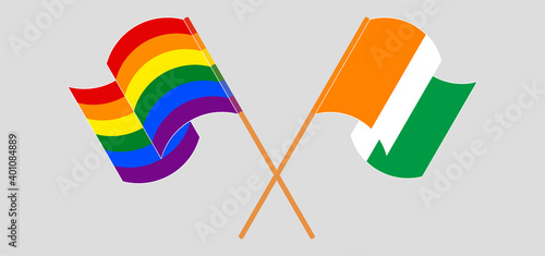 Crossed and waving flags of LGBTQ and Republic of Ivory Coast