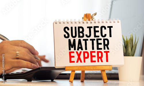 Handwritten text Subject Matter Expert with fountain pen on notebook. Concept image with copy space available.