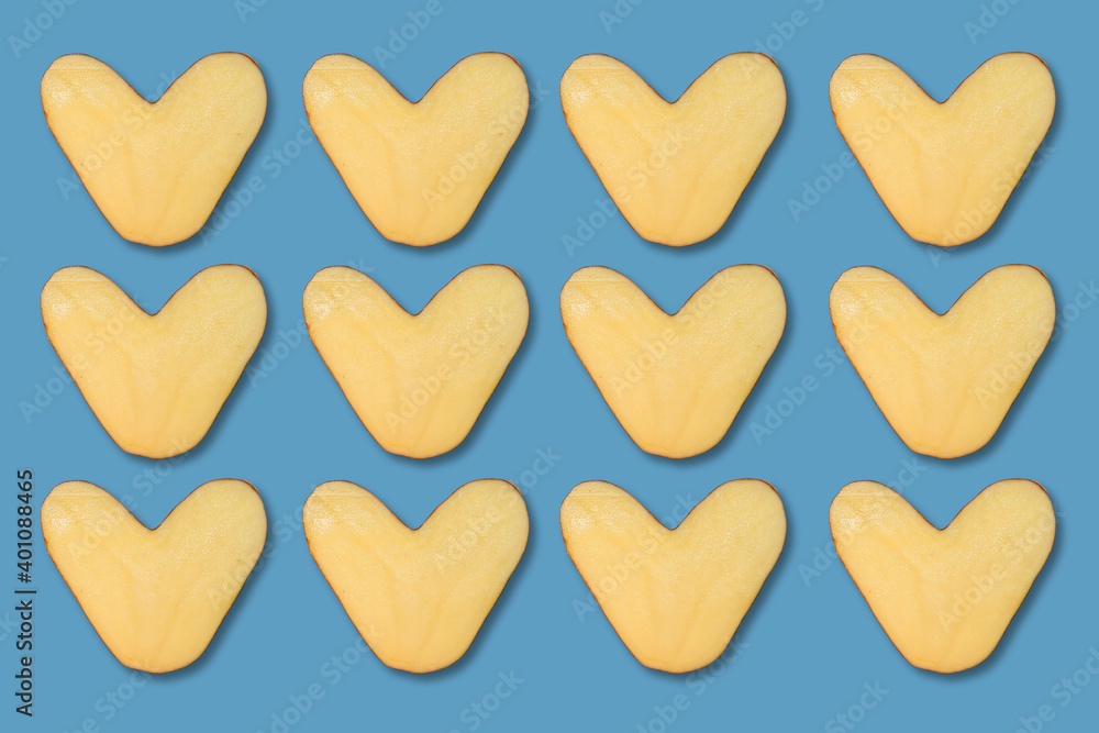 many natural heart-shaped potato isolated on blue background many natural heart-shaped potato isolated on blue background