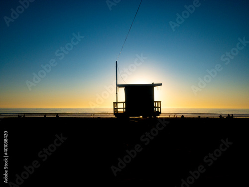 lifeguard tower in sunset, blue sky