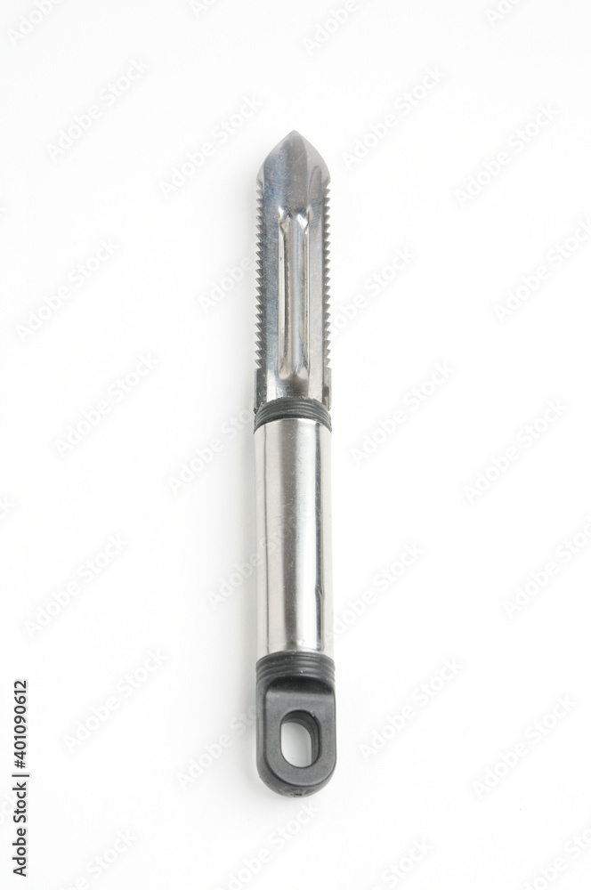 Fruit and vegetable scraper on a white background Fruit and vegetable scraper on a white background