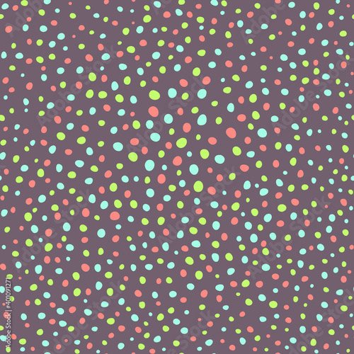 Seamless pattern of multicolored dots on a brown background. Vector illustration.