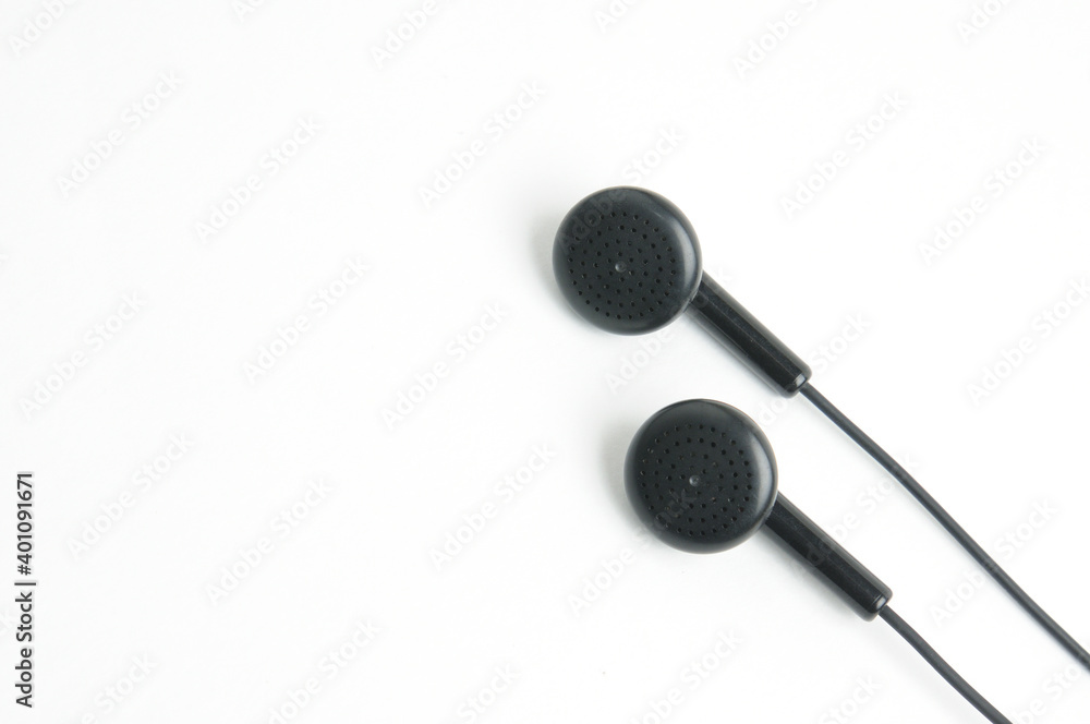 Earphone for music player and smartphone on white background Earphone for music player and smartphone on white background