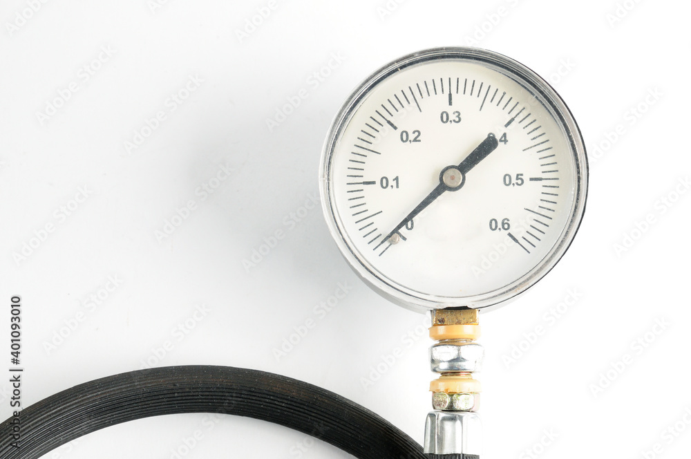Pressure gauge for measuring air pressure in car tires on a white