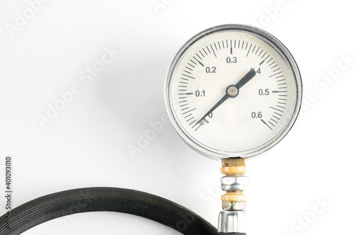 Pressure gauge for measuring air pressure in car tires on a white background