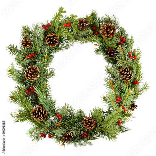 Natural wreath of coniferous branches, decorated with cones and berries, isolated on a white background. Christmas composition. Floral frame. Space for copy.