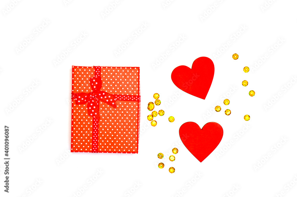 Holiday gift box with red ribbon and wooden heart decorations, christmas holiday concept, valentine's day, mother's day, women's day, birthday Holiday gift box with red ribbon and wooden heart decorations, christmas holiday concept, valentine's day, mother's day, women's day, birthday