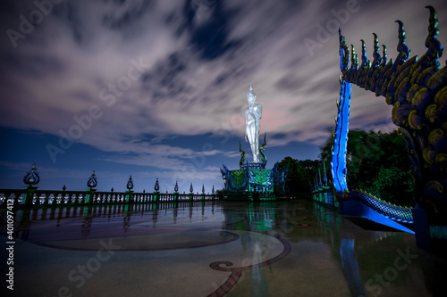 Background of religious attractions in Chonburi province of Thailand (Wat Khao Phra Khru viewpoint), with beautiful Buddha and Phaya Naga statues, tourists always come to make merit and take photos photo