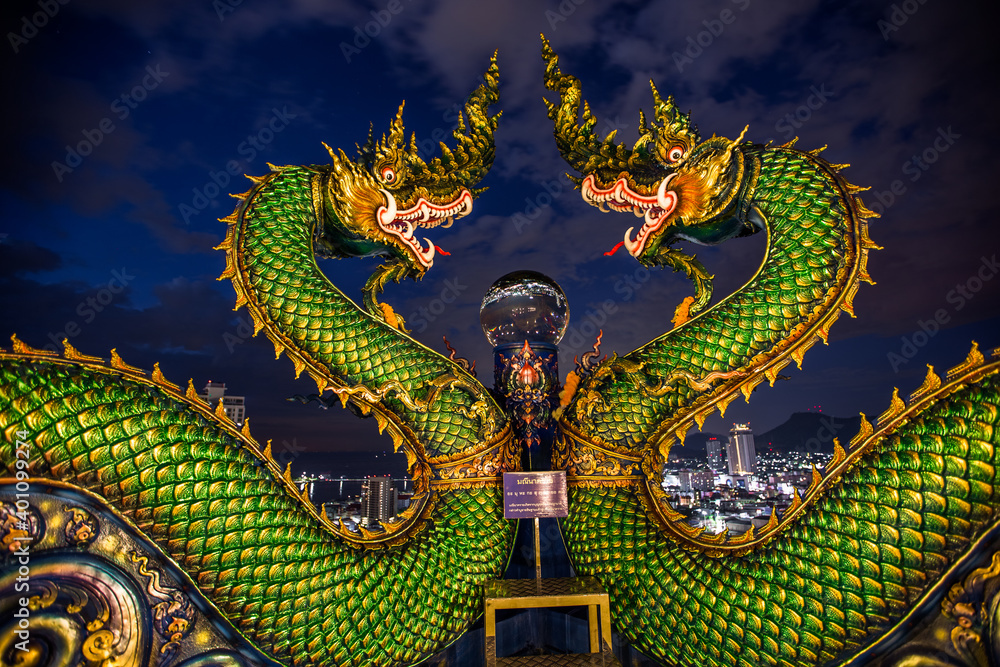 Fototapeta premium Background Wat Khao Phra Kru ,Landmark of sriracha city with two of great Nagas guarded entrance to the view point and the crystal ball that gives an inverted view of theSrirachascenery,Chonburi