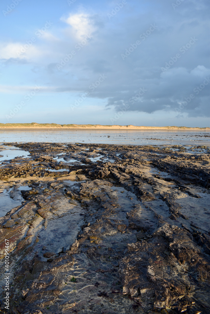 sunset on the low tide beach in normady sunset on the low tide beach in normady