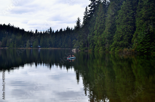 Placid Lake Surrounded with Old Forest 