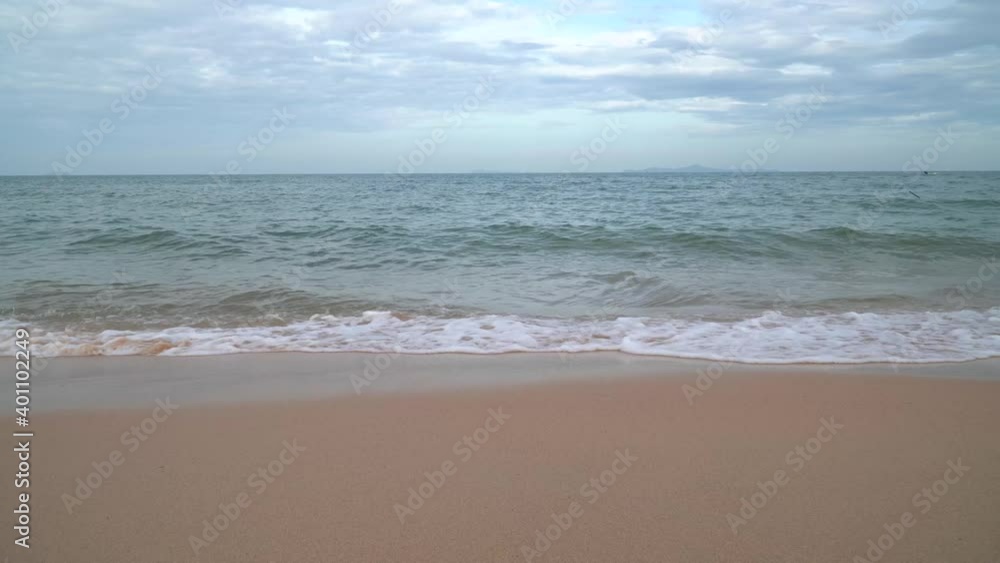 Natural video the scene of the waves in the sea moving towards the coast, with the sun falling with gold reflected in the water At the Andaman Sea in Phuket 4K Resolution wide angle shot.mp4 Natural video the scene of the waves in the sea moving towards the coast, with the sun falling with gold reflected in the water At the Andaman Sea in Phuket 4K Resolution wide angle shot.mp4