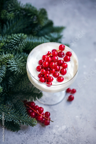 Yogurt and redcurrant in a glass