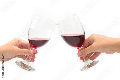 Cheer a glass of two red wine isolated