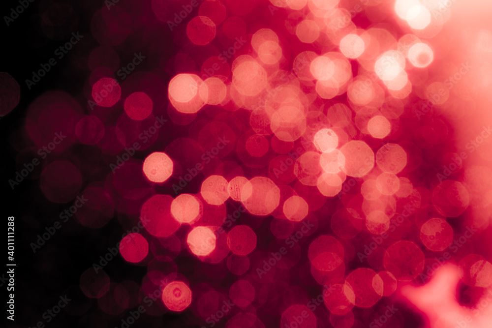 Red light glowing defocused holiday blurr bokeh in black