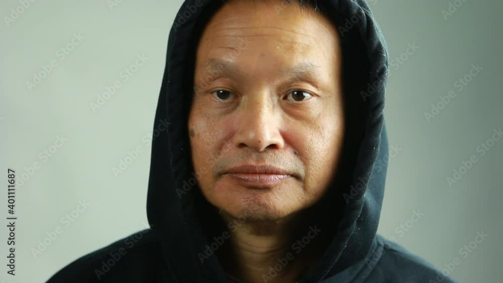 Close up man in hood, in studio Chiangmai Thailand Close up man in hood, in studio Chiangmai Thailand