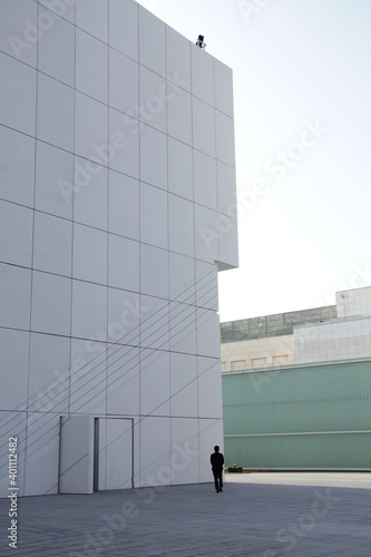 Lonely man in middle of white building