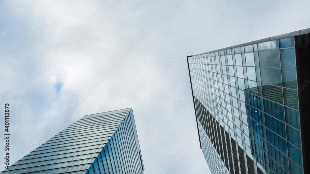Time Lapse of clouds over office buildings in Tokyo, Japan Time Lapse of clouds over office buildings in Tokyo, Japan
