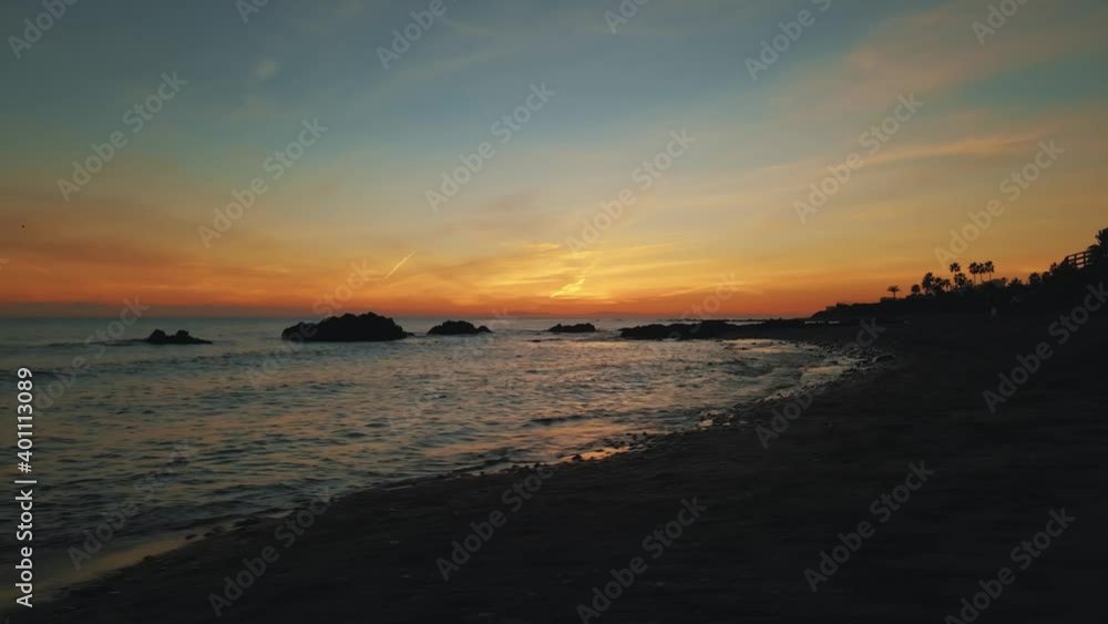 Sunset at the beach with golden sky Sunset at the beach with golden sky