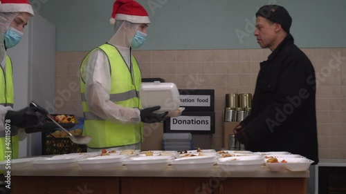 Donate food to hungry people, Give Back. Concept of poverty and hunger. Volunteer pack meals for undernourished people. Food bank, donation box. Homeless shelter during Covid-19 and Christmas