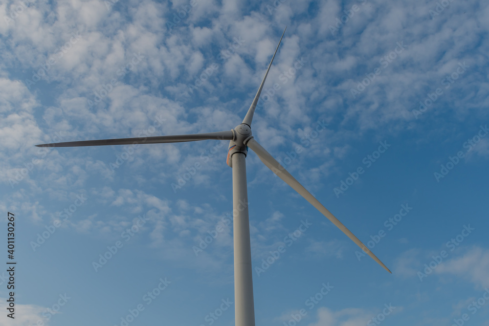 Electrical generating windmill against cloudy sky. Electrical generating windmill against cloudy sky.