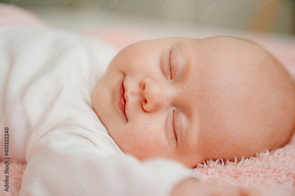 sleeping baby under the pink blanket. healthy sleep in newborns. sleeping baby under the pink blanket. healthy sleep in newborns.