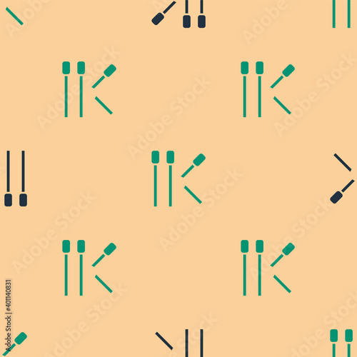 Green and black Matches icon isolated seamless pattern on beige background. Vector.