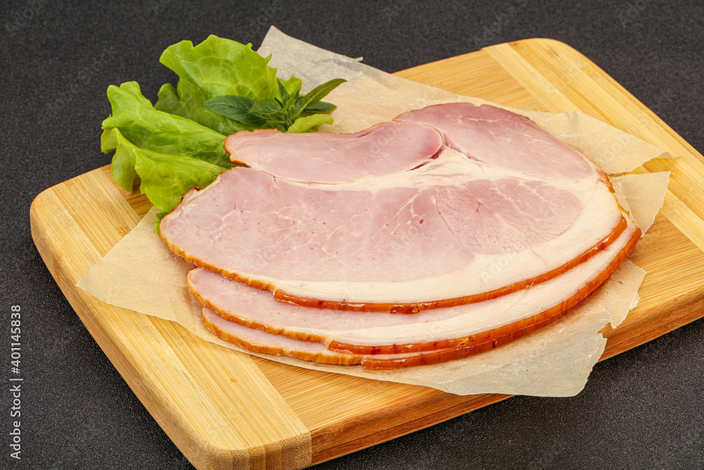 Sliced pork belly over board