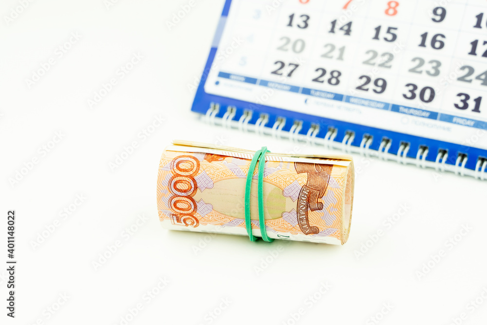 Russian money on the background of the calendar Russian money on the background of the calendar